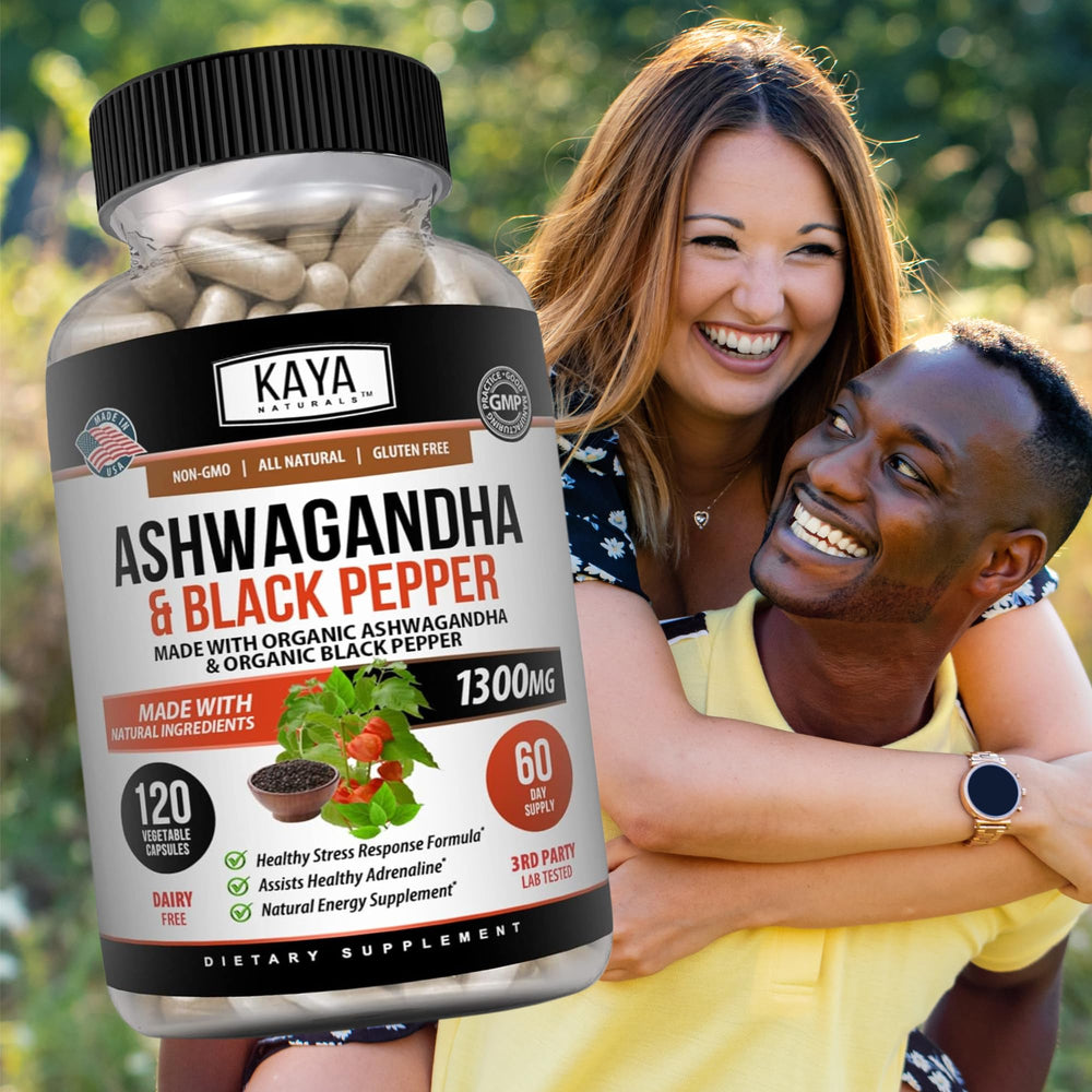 Ashwagandha capsules being held for size reference