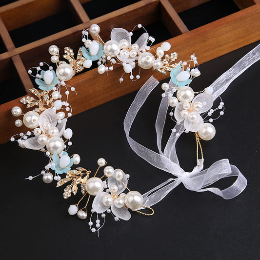 Kayzon blue pearl rhinestone headband highlights sparkling accents for photos and ceremonies.