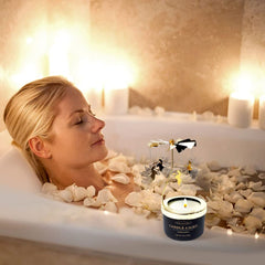 Relaxing aromatherapy candle in dark glass with gold lettering