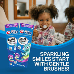Child brushing teeth with color-changing toothpaste