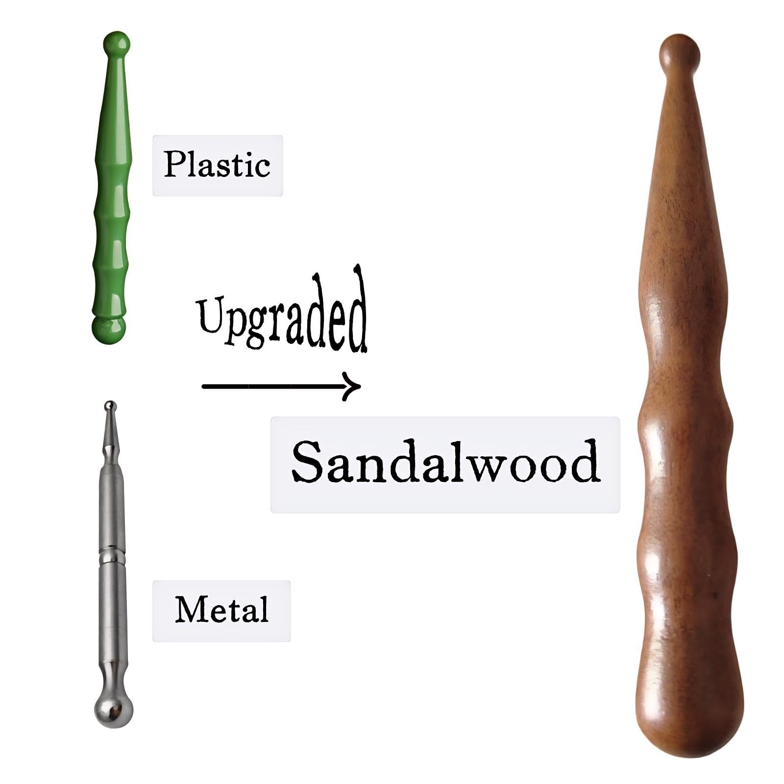 Close-up of sandalwood massage pen tip for precise acupoints