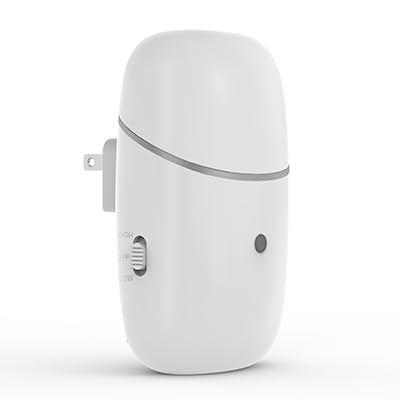 Kuandawei plug-in waterless diffuser plugged into wall outlet showing wall-mount design and aroma potential