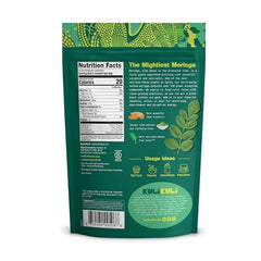 Moringa powder in a tin jar