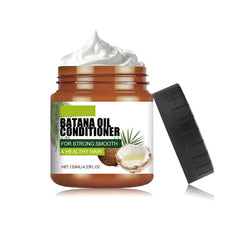 KunMan Batana Oil Conditioner bottle highlights nourishing scalp hydration.