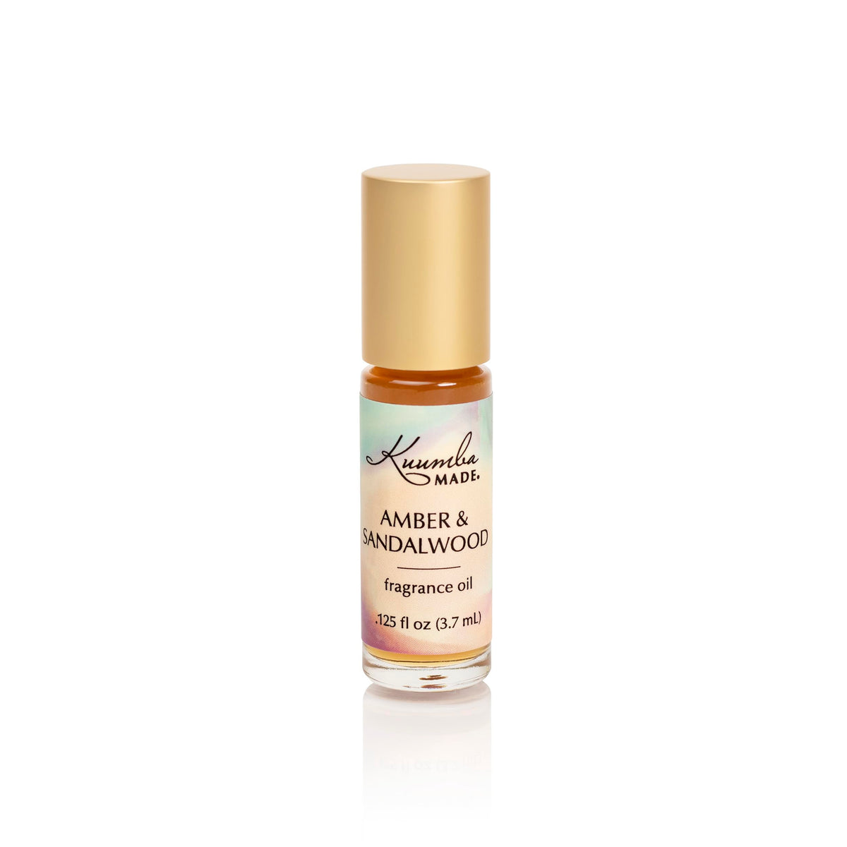 Kuumba Made Amber and Sandalwood roll-on bottle for on-the-go, long-lasting fragrance.