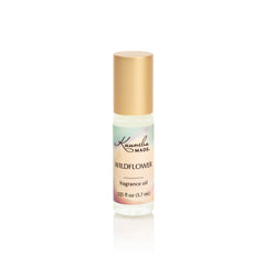 Kuumba Made Wildflower Fragrance Oil bottle pour for DIY blends and mood-enhancing aromas.