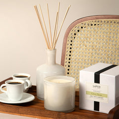 15.5 oz Celery Thyme candle with modern home decor setting