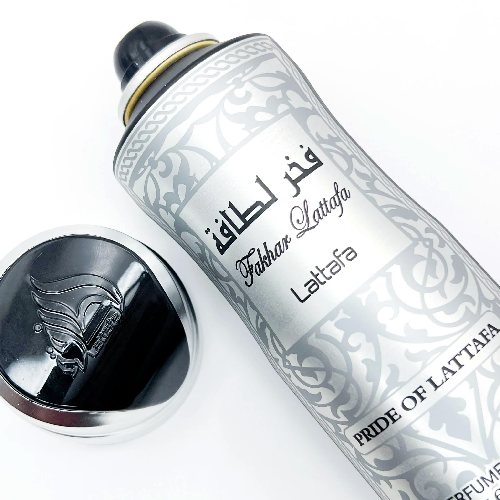 Lattafa Fakhar Men nozzle closeup showing a smooth mist