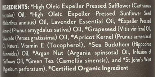 Lavender essential oil bottle with herbs