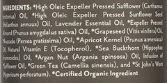 Lavender essential oil bottle with herbs
