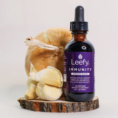Lifestyle shot of a person administering a dropper dose of the blend
