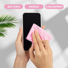 Using pink microfiber cloth to clean eyeglasses