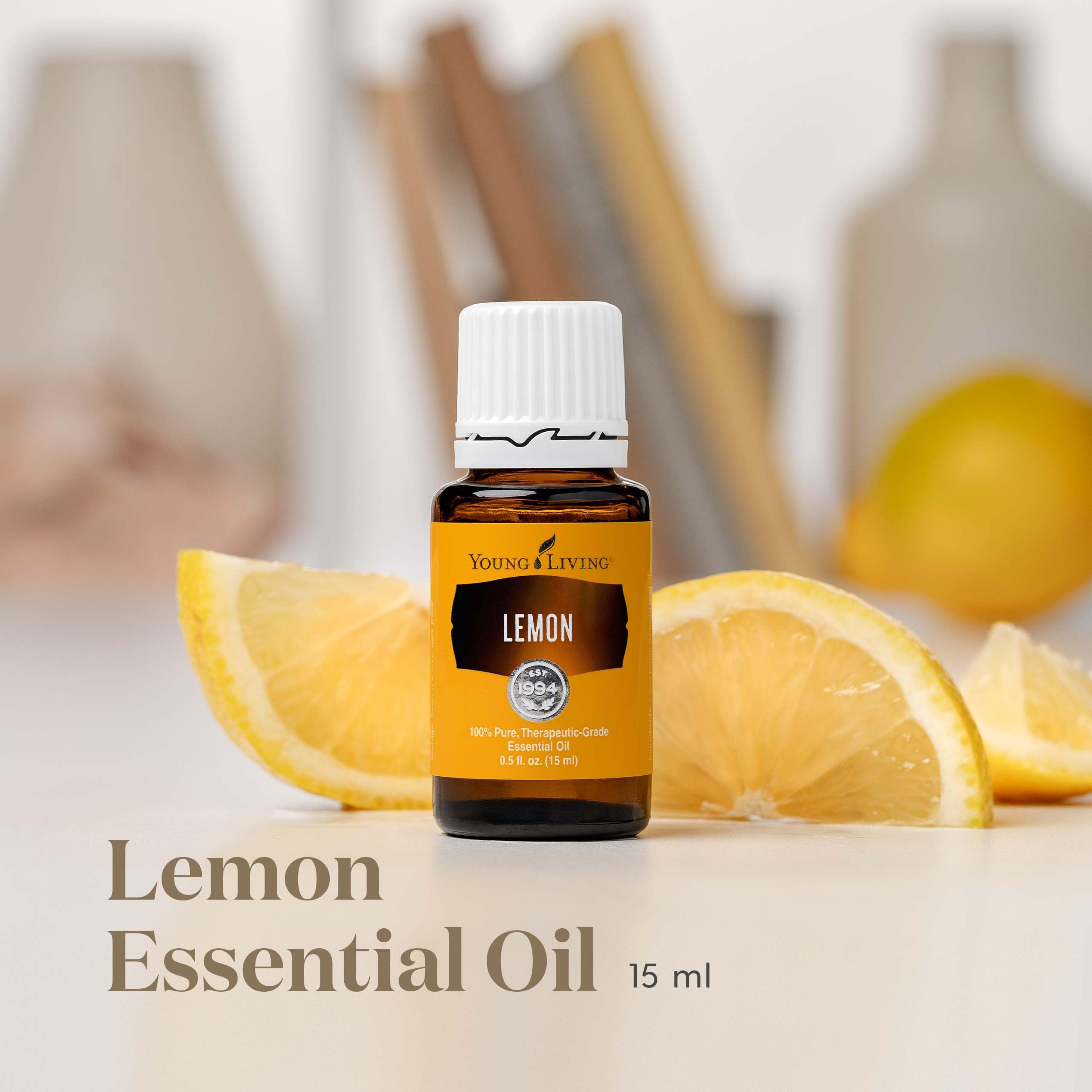 Lemon essential oil bottle with lemon slices