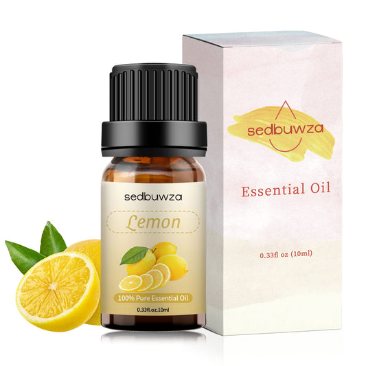 Lemon essential oil bottle on a white surface