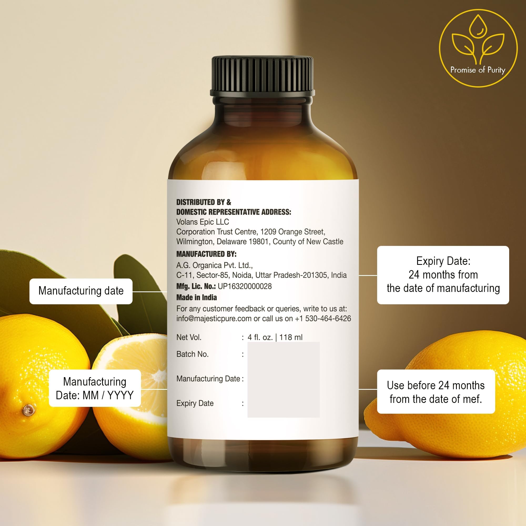 Lemon slices beside Majestic Pure Lemon Essential Oil bottle