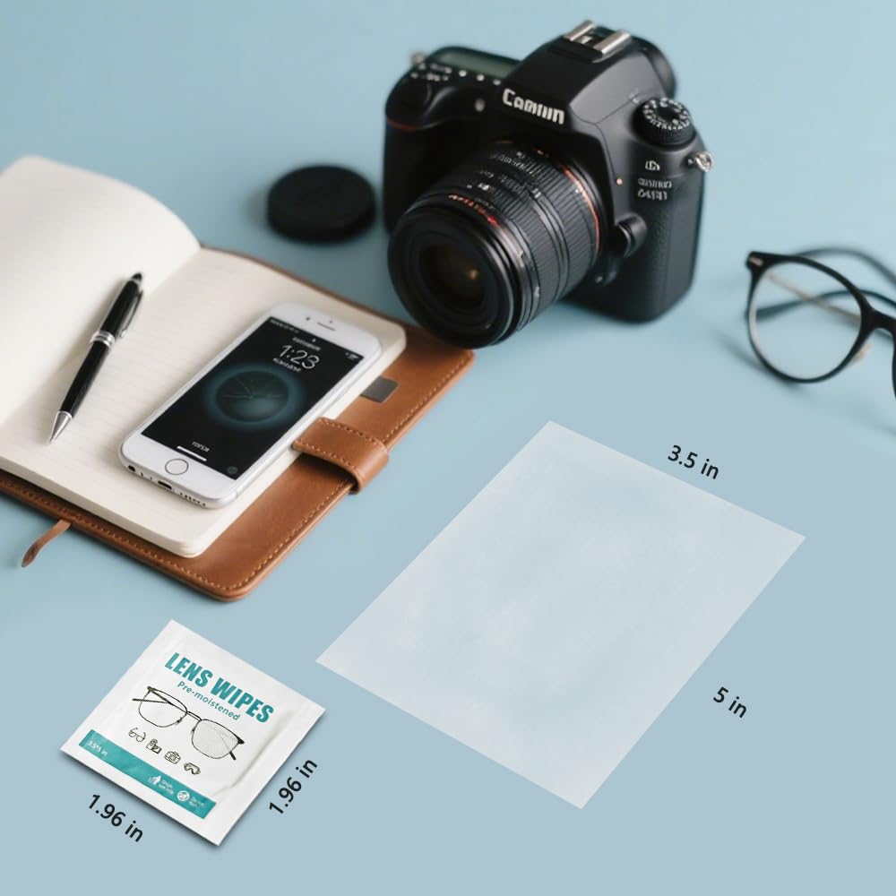 Hands using lens wipe on a phone and tablet screen