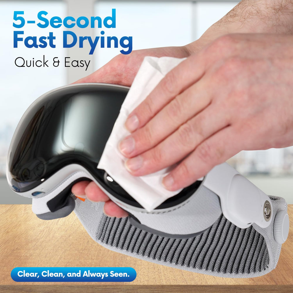 Close-up of wipe removing smudges from eyeglasses