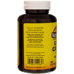 Close-up of softgel capsules with bottle in background
