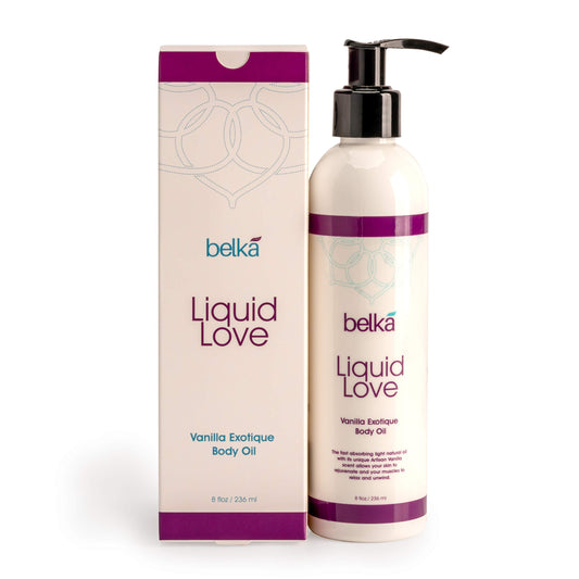 Liquid Love Vanilla Exotique Body Oil bottle on a spa setting