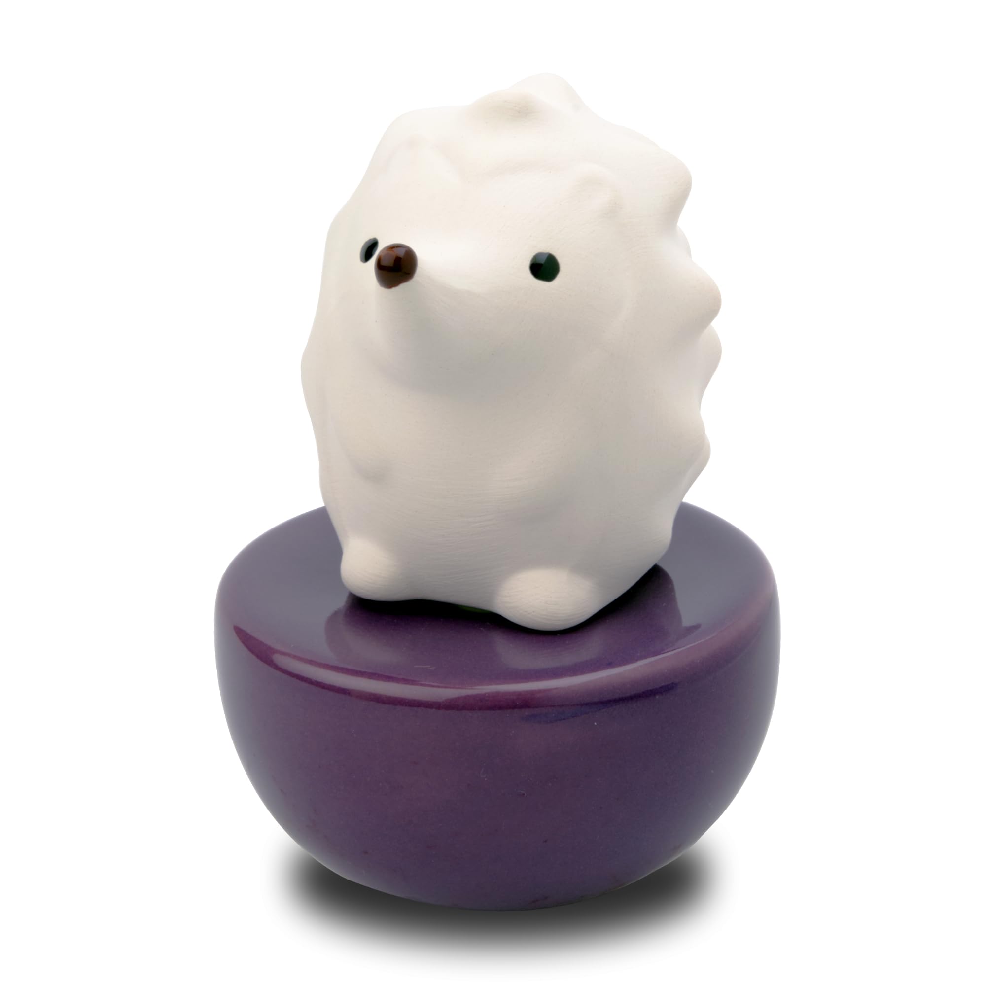 Lively Breeze spiky hedgehog diffuser white on desk for calming aromatherapy.