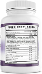 Vitamin capsules and natural ingredients on a wooden table