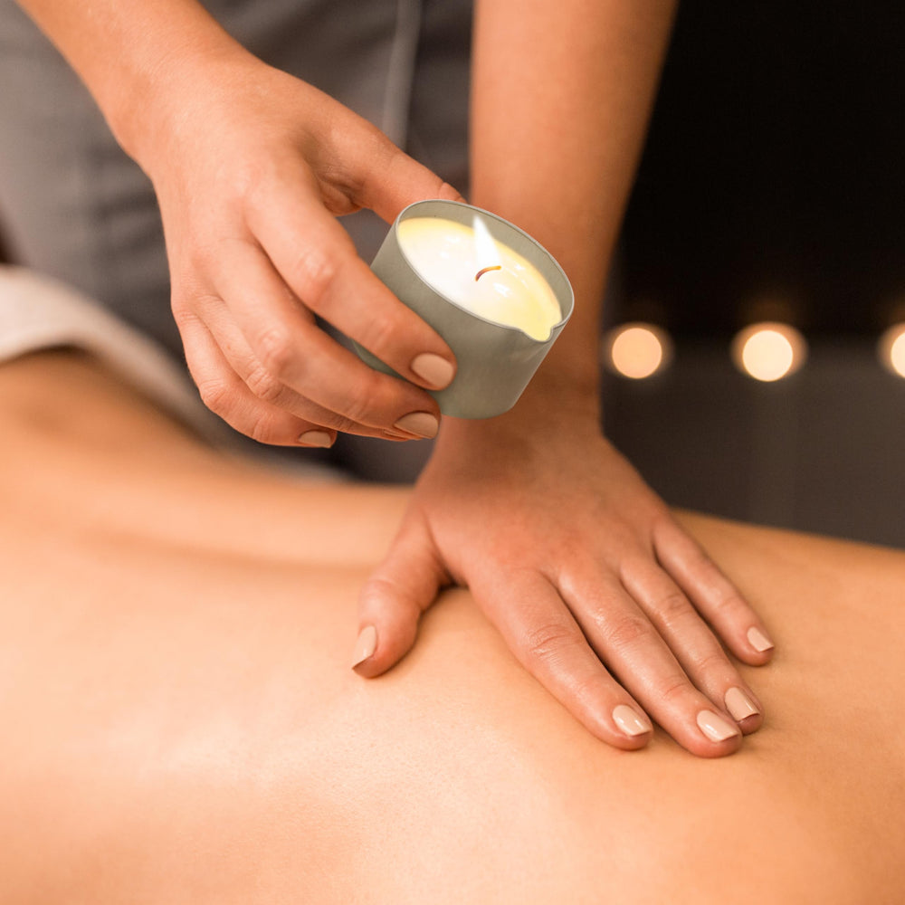 Candle transitioning to warm massage oil for easy application
