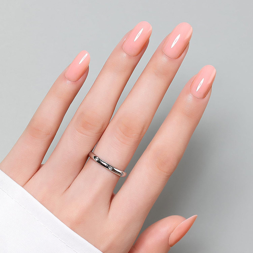 Luxbon short rounded press-on nails pack open showing multiple sizes for at-home manicure.