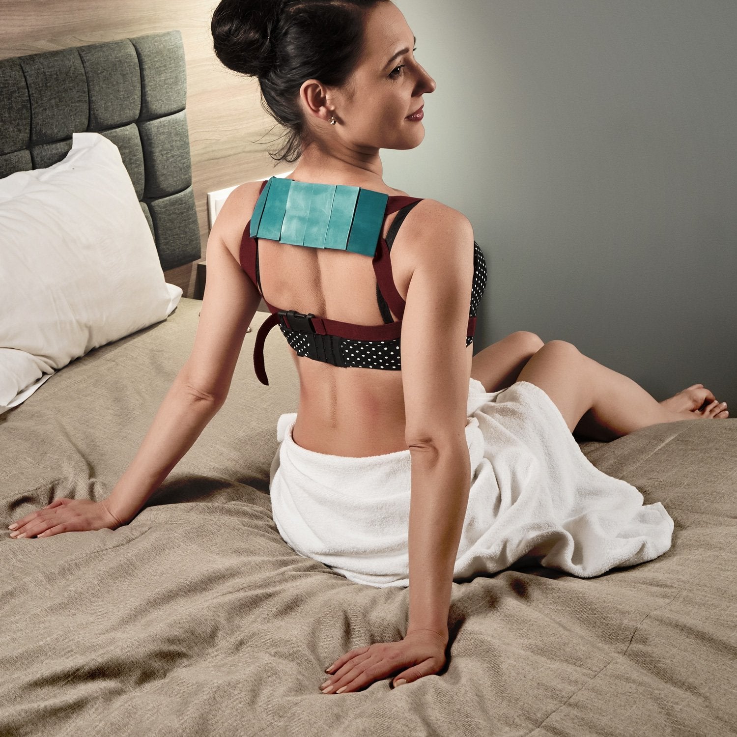Person wearing Lyapko belt while working at a desk