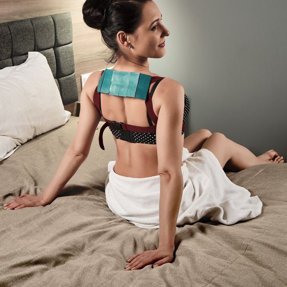 Person wearing Lyapko belt while working at a desk