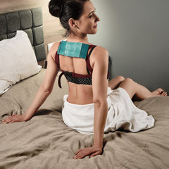 Person wearing Lyapko belt while working at a desk