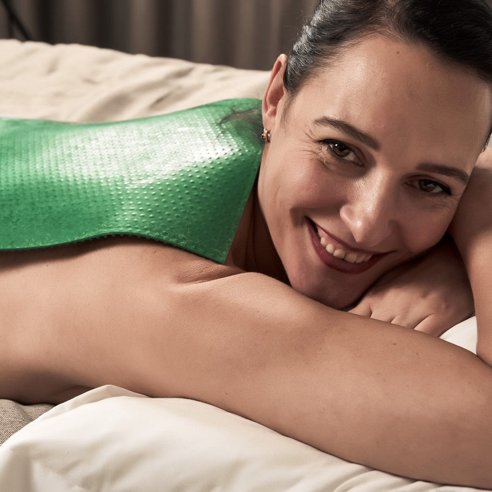 Lyapko mat being used on feet and larger body areas for home massage
