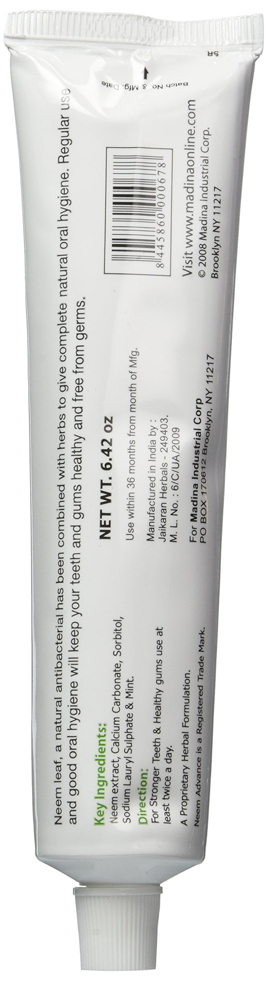 Close-up of Neem leaf and mint imagery on toothpaste packaging