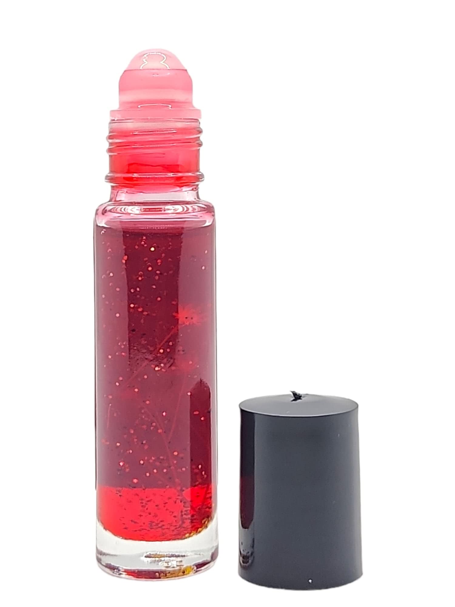 Close-up of Magick Space Love Honey Pheromone Roll-On Perfume Oil 10ML with decorative herbs