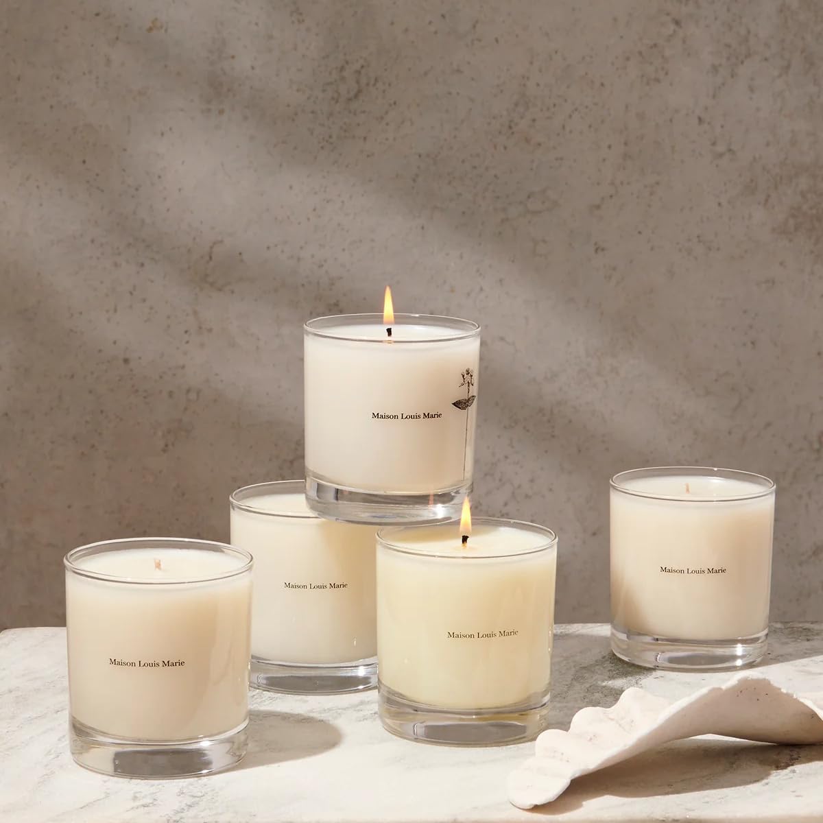 Side view of Maison Louis Marie No.01 Scalpay candle on a neutral surface