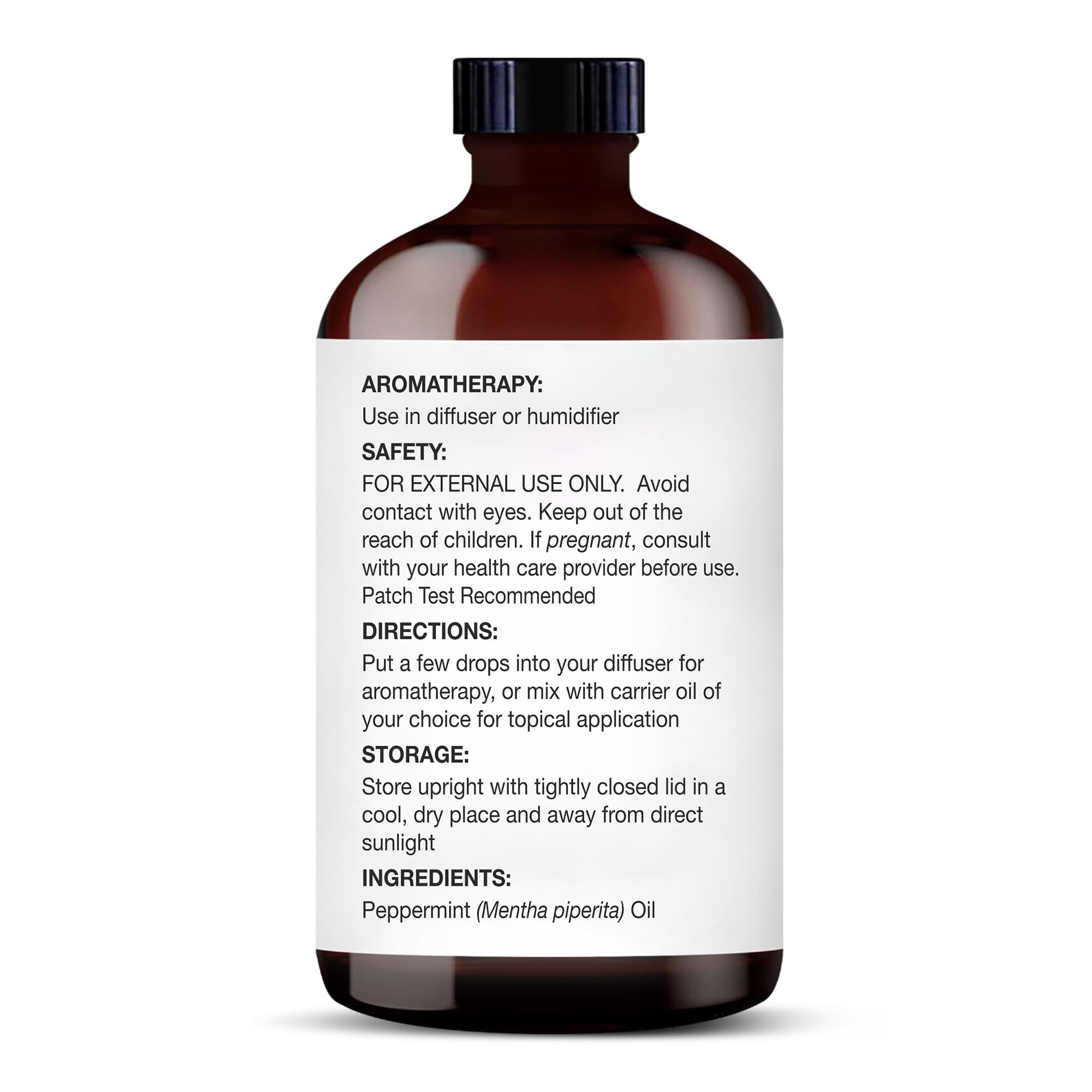 Glass dropper dispensing peppermint essential oil
