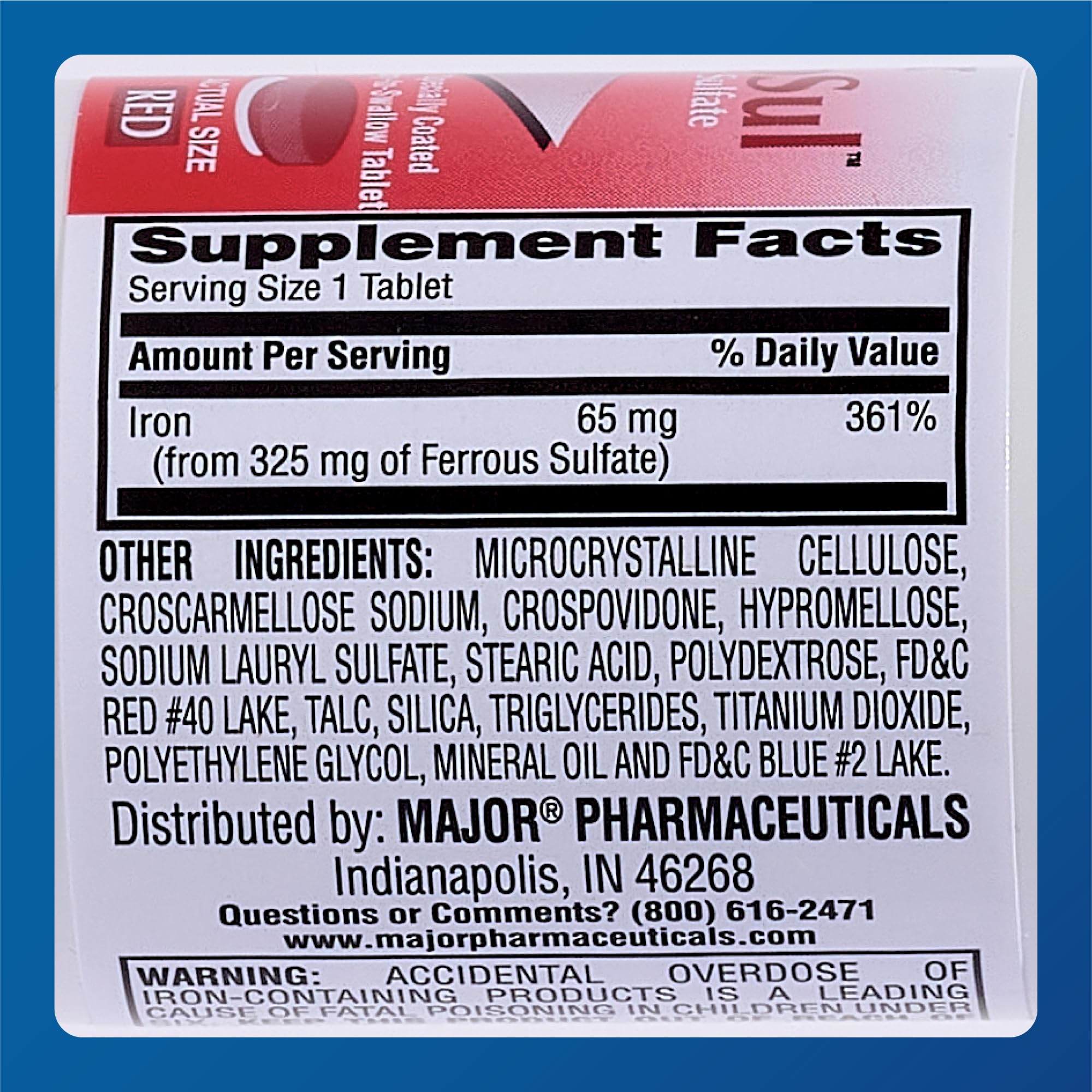 Close-up of a red 325mg ferrous sulfate tablet