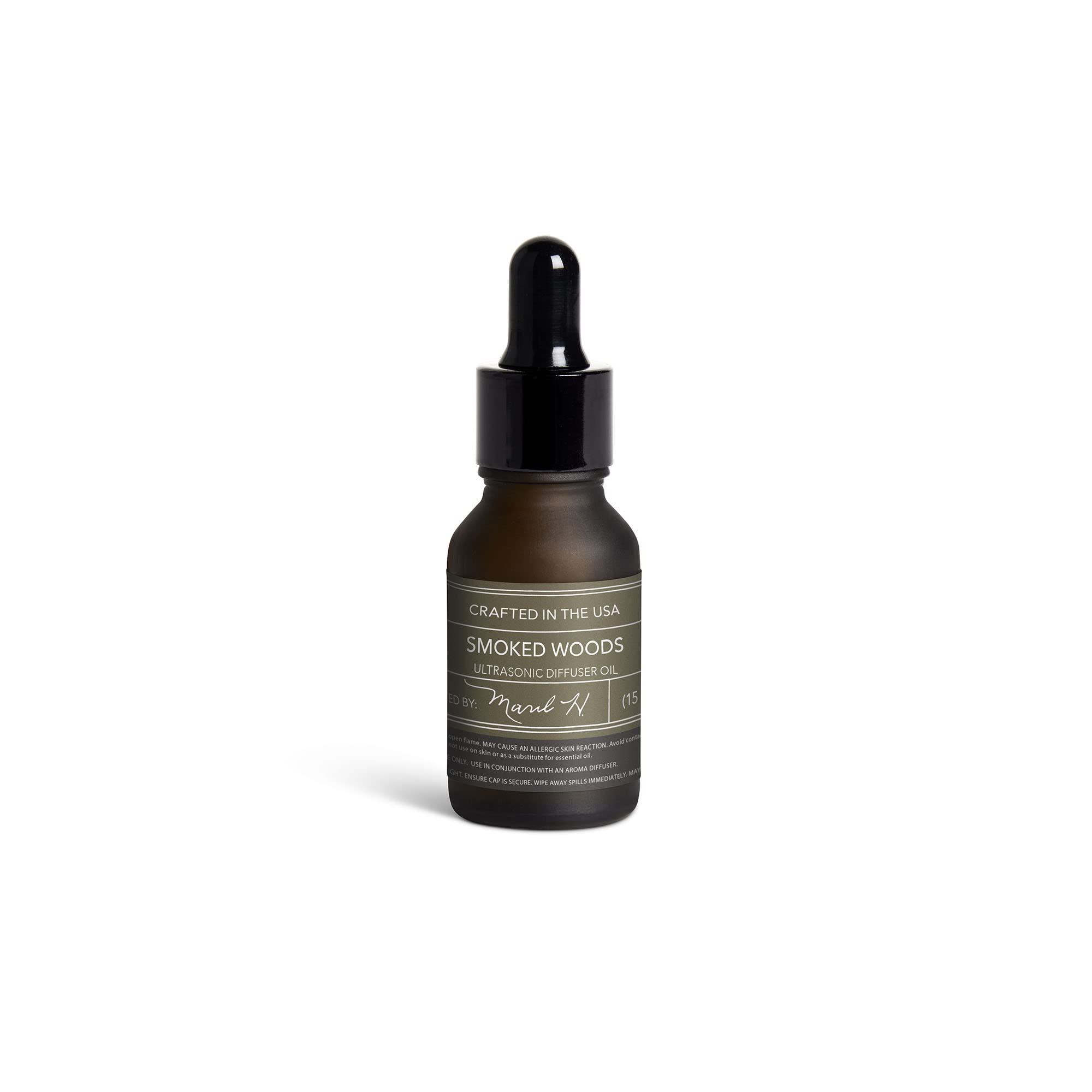 MARIL Smoked Woods diffuser bottle delivering room-filling aroma.