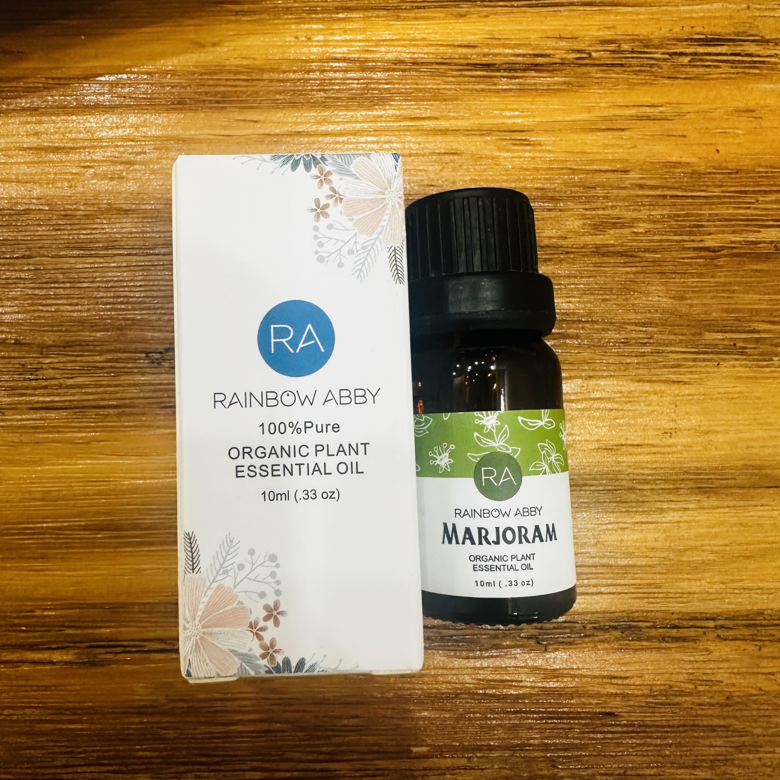 Close-up of Rainbow Abby marjoram essential oil bottle label