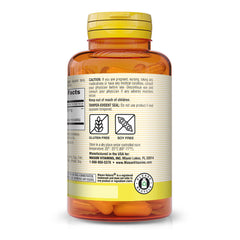 Close-up of turmeric capsules in a bottle