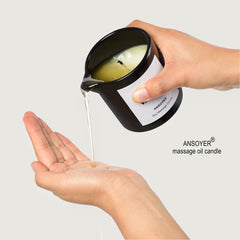 Burning massage oil candle with warm vanilla aroma
