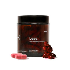 Bottle of MAUDE Base probiotic capsules with label