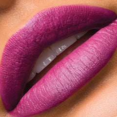 Maybelline Orchid Shock swatch on lips shows bold color payoff.