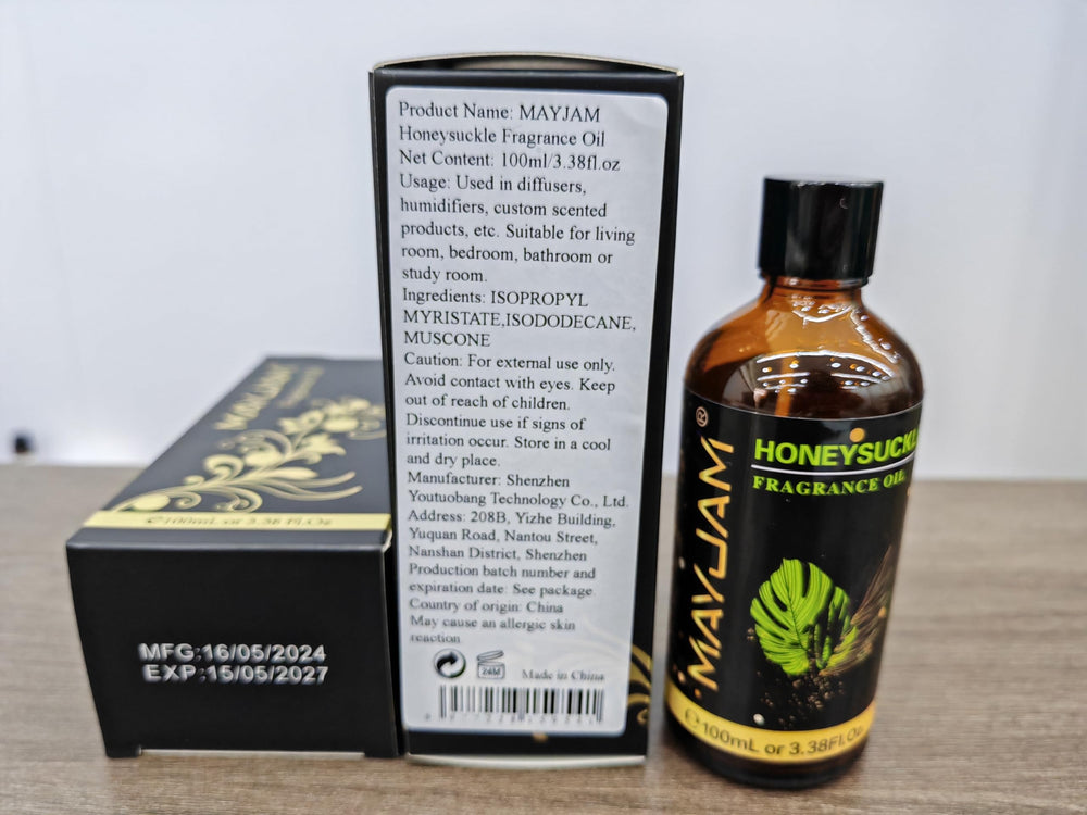 Close-up of MAYJAM Honeysuckle Fragrance Oil bottle