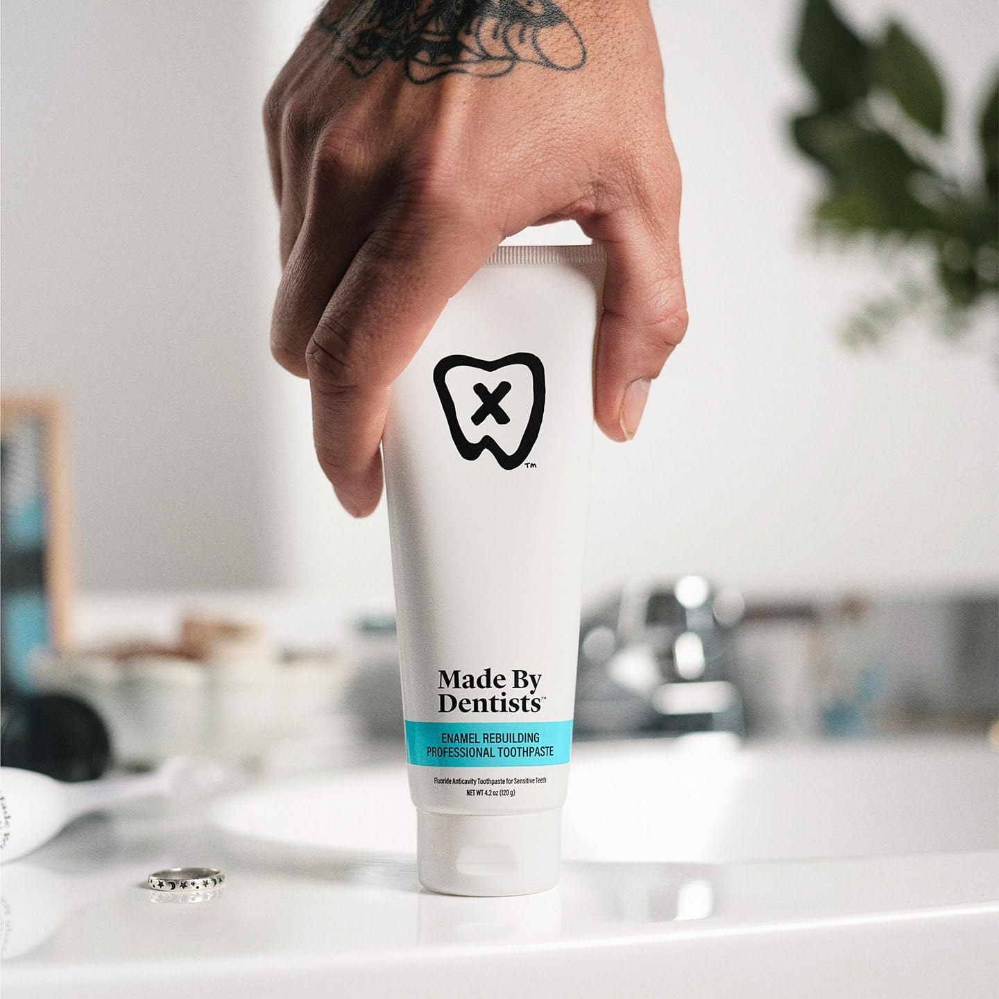 Toothpaste tube showing fluoride and remineralizing ingredients