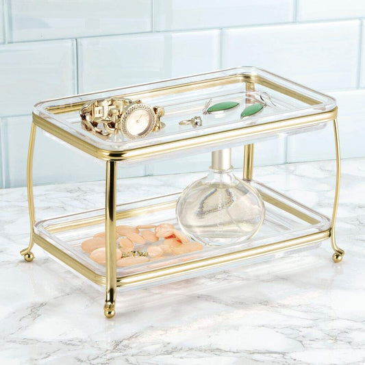 mDesign soft brass clear vanity tray with two-tier design ideal for small spaces.