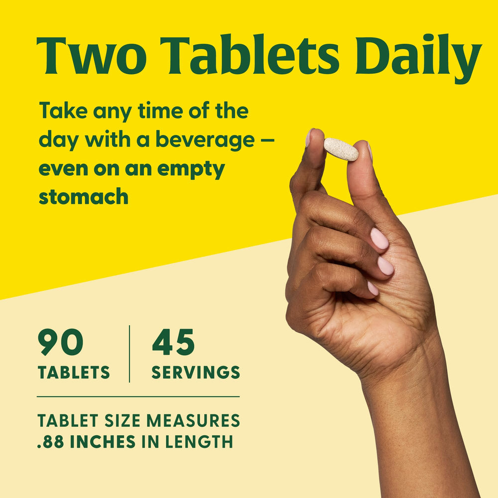 MegaFood Thyroid Strength tablets shown ready to take with a beverage.