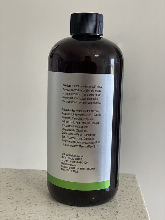 Breath-Away Mouth Rinse bottle highlighting peppermint, cinnamon, clove, rosemary and T36-C5 oil