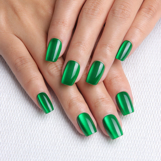 Melines green cat eye short square nails close-up highlighting glossy finish