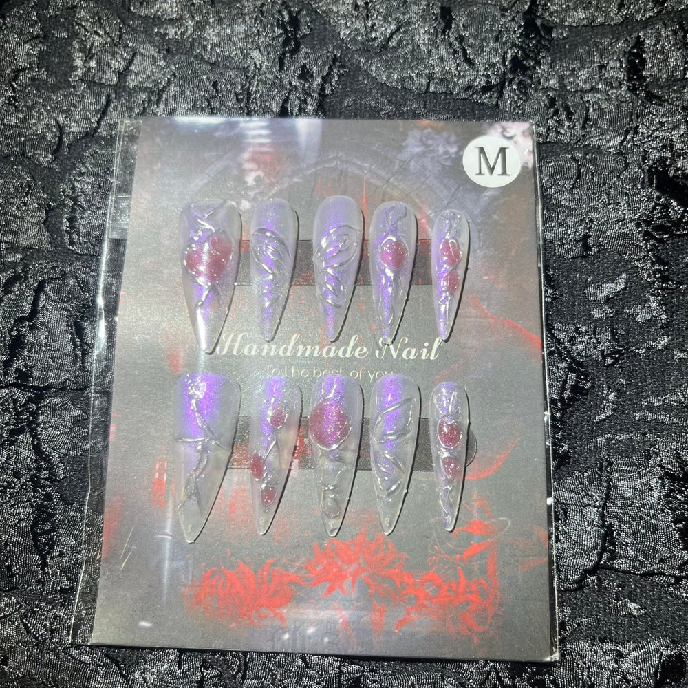 MellowBells nail set with rhinestones and charms adds shimmer and premium detail