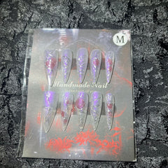 MellowBells nail set with rhinestones and charms adds shimmer and premium detail
